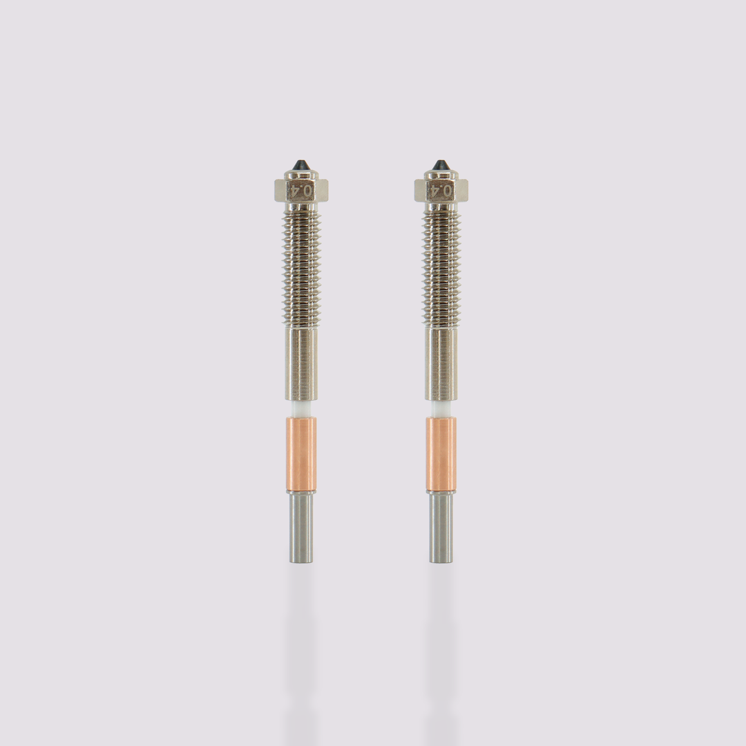 Two QIDI Tech Max4 bimetal nozzles with 0.4 mm markings
