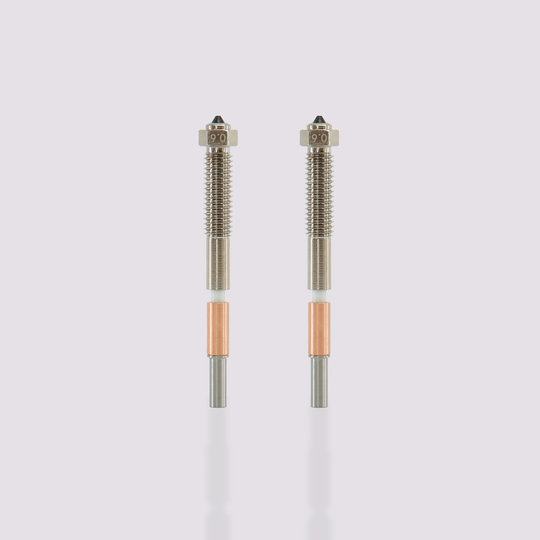 Two QIDI Max4 bimetal nozzles with 0.6mm markings, featuring integrated all-metal design for easy replacement.